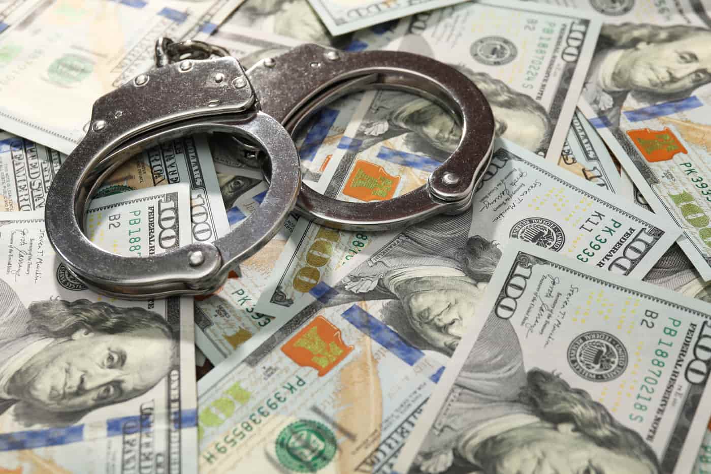 Bail bond premium in Concord: US dollars and handcuffs
