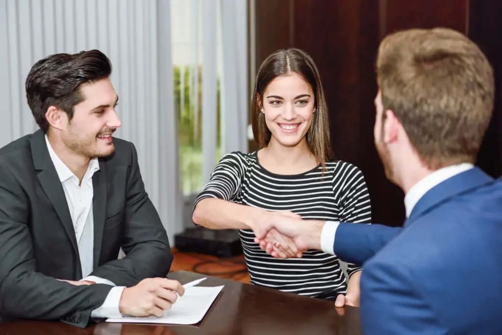 Bail agent and co-signer reviewing a bail bond agreement